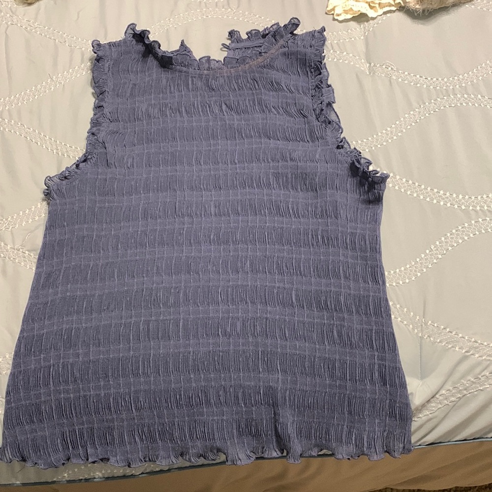 Slate blue sleeveless top.
